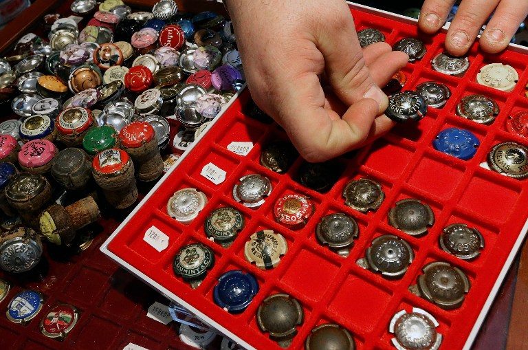 PASSION. For collectors, these champagne caps are an art form and a valuable investment. Photo by Francois Nascimbeni/AFP 