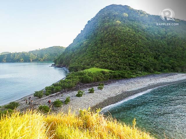 TWIN BEACH. You can trek up Pitogo Island’s green hill to see the stone beach of Lantangan from above 