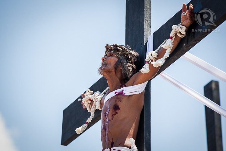 CRUCIFIED. Wilfredo Salvador is nailed to the cross and raised for a few minutes and then sent to a medical tent to receive treatment.  