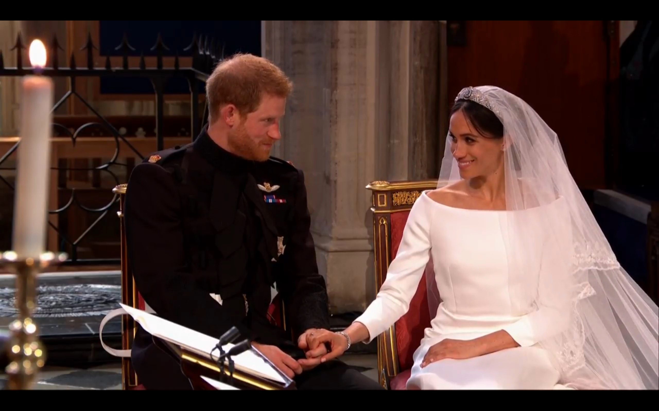 HOLDING HANDS. The couple hold hands as they listen to Curry speak during their wedding ceremony on Saturday, May 19. Screenshot from The Royal Family's YouTube channel  