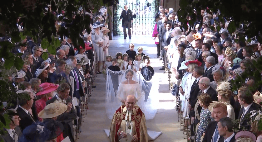 DOWN THE AISLE. The bride enters St George's Chapel at Windsor Castle. Screenshot from The Royal Family's YouTube channel 