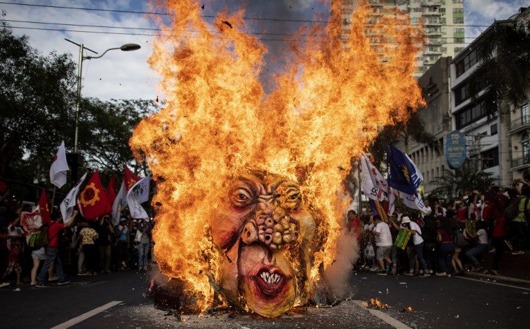 DUTERTE IN FLAMES. Activists burn an effigy of President Rodrigo Duterte near the US Embassy in Manila on November 30, 2018, during the commemoration of the 155th birthday of working-class hero Andres Bonifacio. Photo by Noel Celis/AFP   