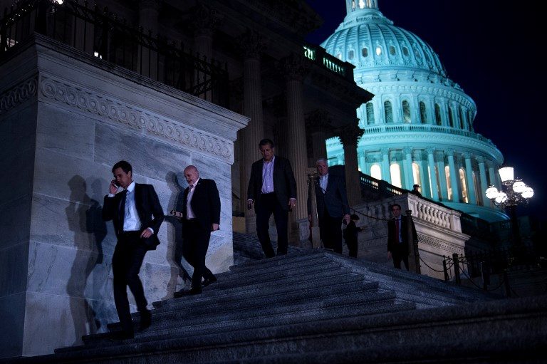 SHUTDOWN ENDS. Members of the House of Representatives leave after a vote on Capitol Hill after the House and Senate moved to end a government shutdown, on January 22, 2018, in Washington, DC. Photo by Brendan Smialowski/AFP  