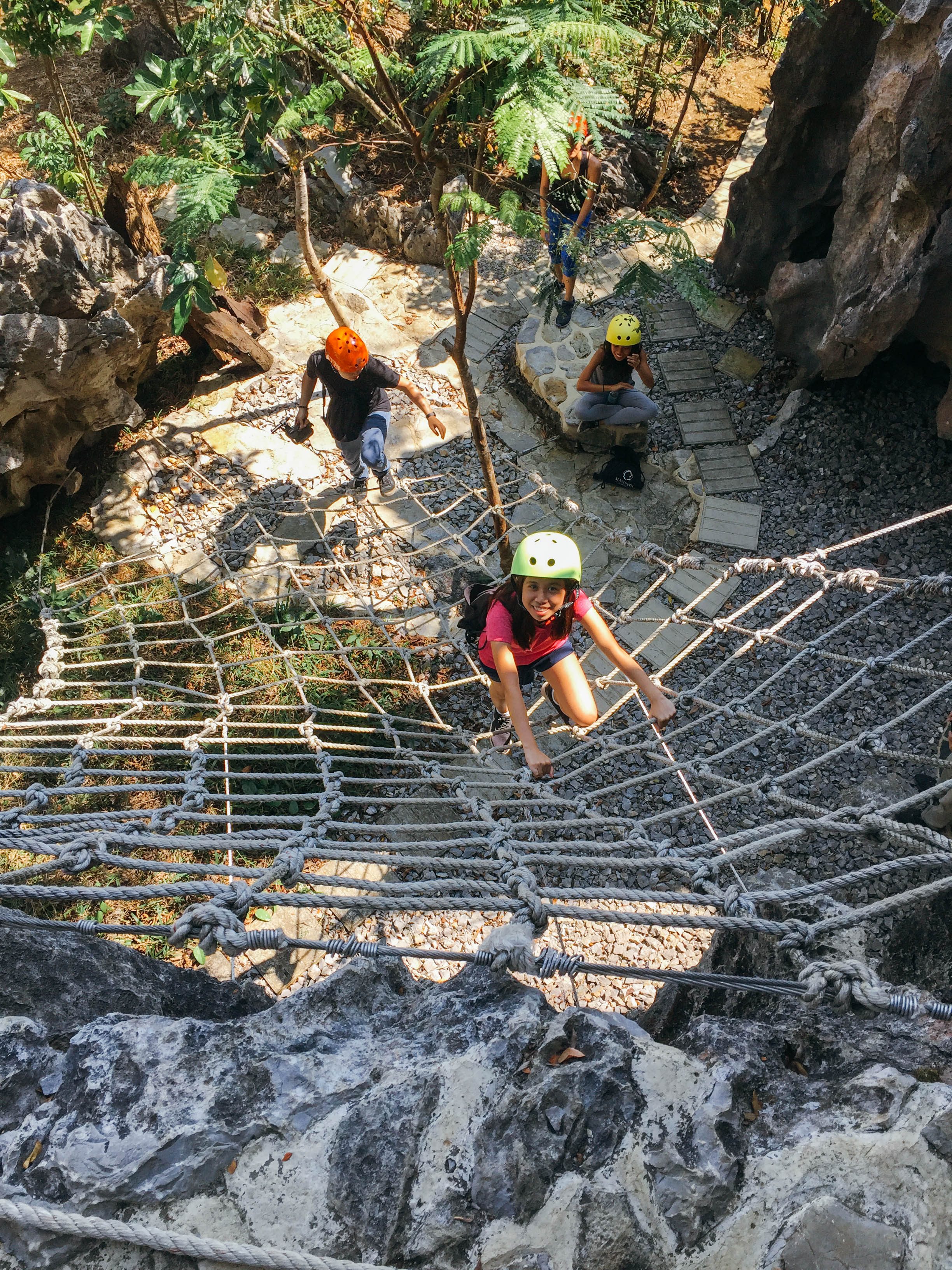 LAMBAT. The first rope course that visiting groups will encounter in Masungi is a rope net that allows them to climb a rock wall and onto the rest of the conservation. Photo by Nicole Reyes/Rappler 