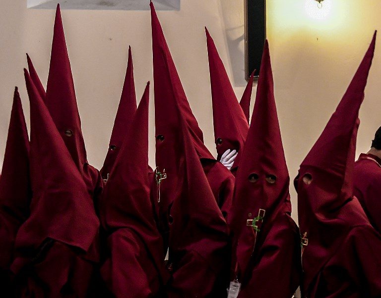 BROTHERHOOD. Members of the Nazarenos brotherhood wait to participate in the Jesus Nazareno children's procession as part of Holy Week celebrations in Zipaquira, Colombia, on March 26, 2018. Photo by Luis Acosta/AFP   