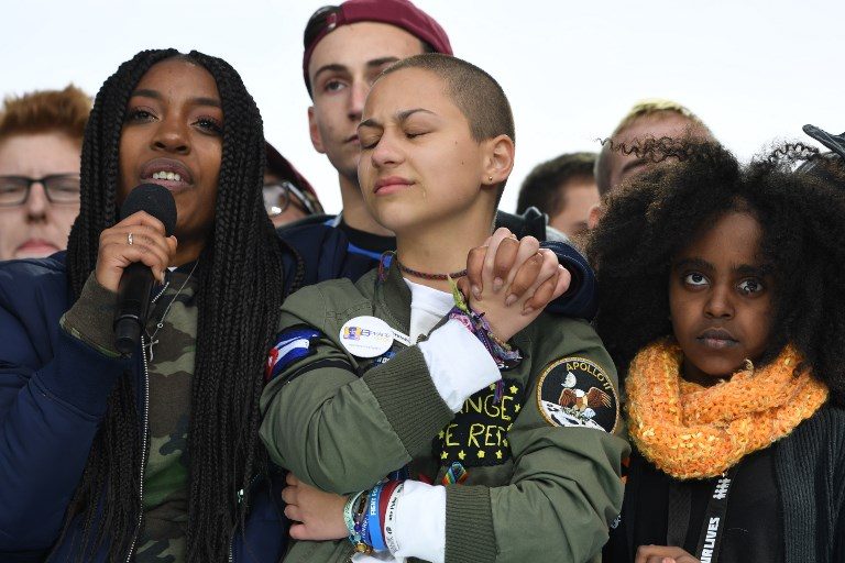 #NEVERAGAIN. Marjory Stoneman Douglas High School student Emma Gonzalez (center) listens with other students during the March for Our Lives Rally in Washington, DC on March 24, 2018. Photo by Jim Watson/AFP   