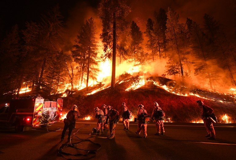 WILDFIRE. Firefighters try to control a back burn as the Carr fire continues to spread towards the towns of Douglas City and Lewiston near Redding, California on July 31, 2018. Photo by Mark Ralston/AFP  