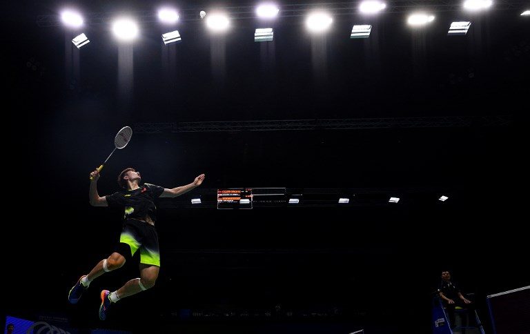 SMASH. Shi Yuqi of China hits a shot against Rajiv Ouseph of England in their men's singles match during the badminton World Championships in Nanjing, Jiangsu province on August 1, 2018. Photo by Johannes Eisele/AFP  
