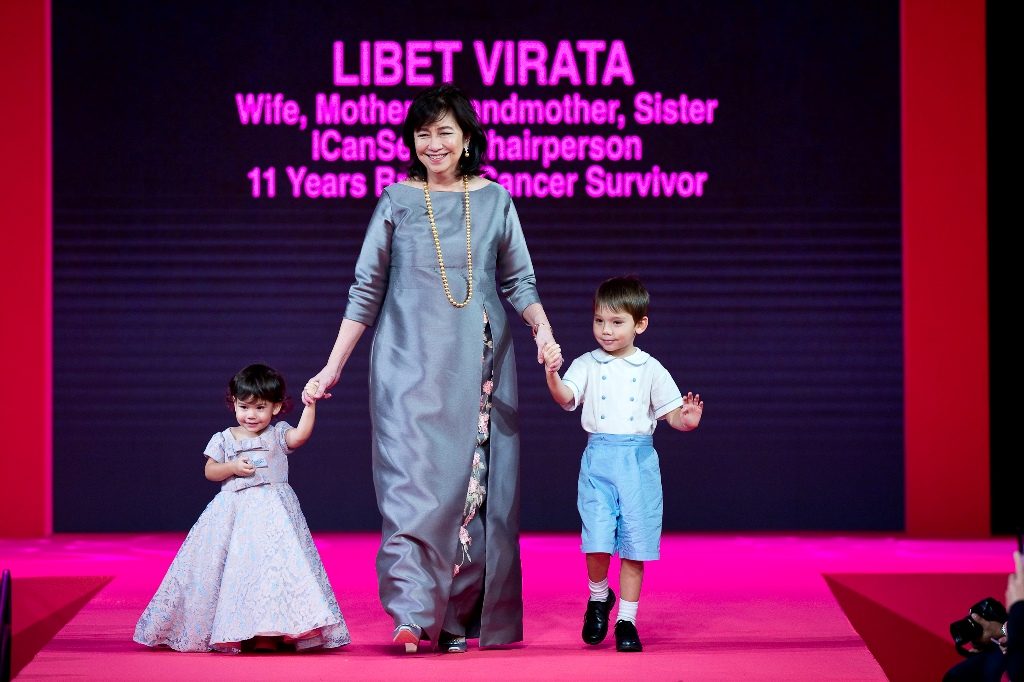Libet Virata, ICanServe chairperson and 11-year breast cancer survivor, wearing JC Buendia, with grandchildren Lovisa and Eleus wearing Rustan's outfits. 