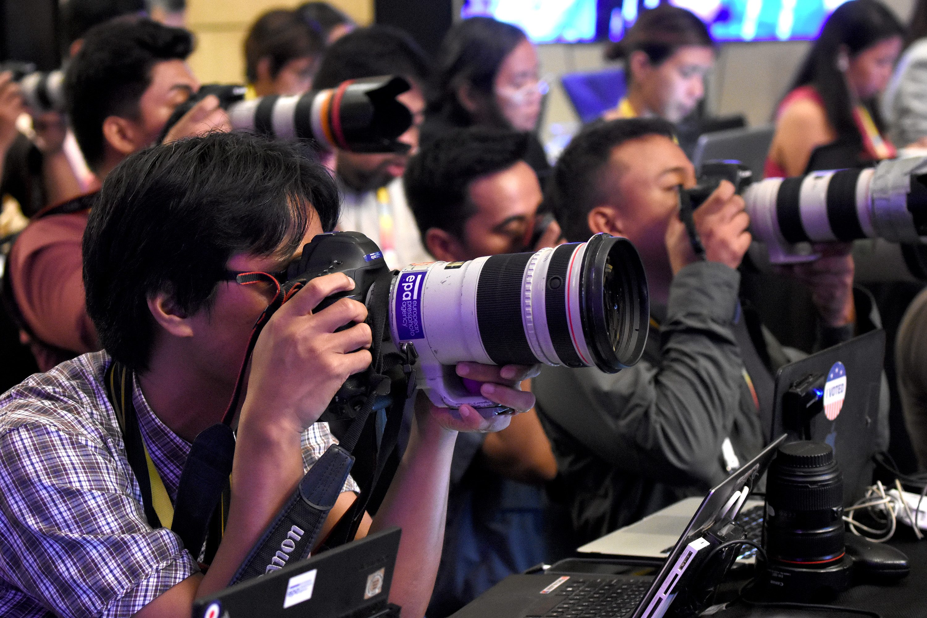 HARD AT WORK. In ASEAN as in other assignments, photojournalism is about taking the best shot. Photo by Angie de Silva/Rappler  