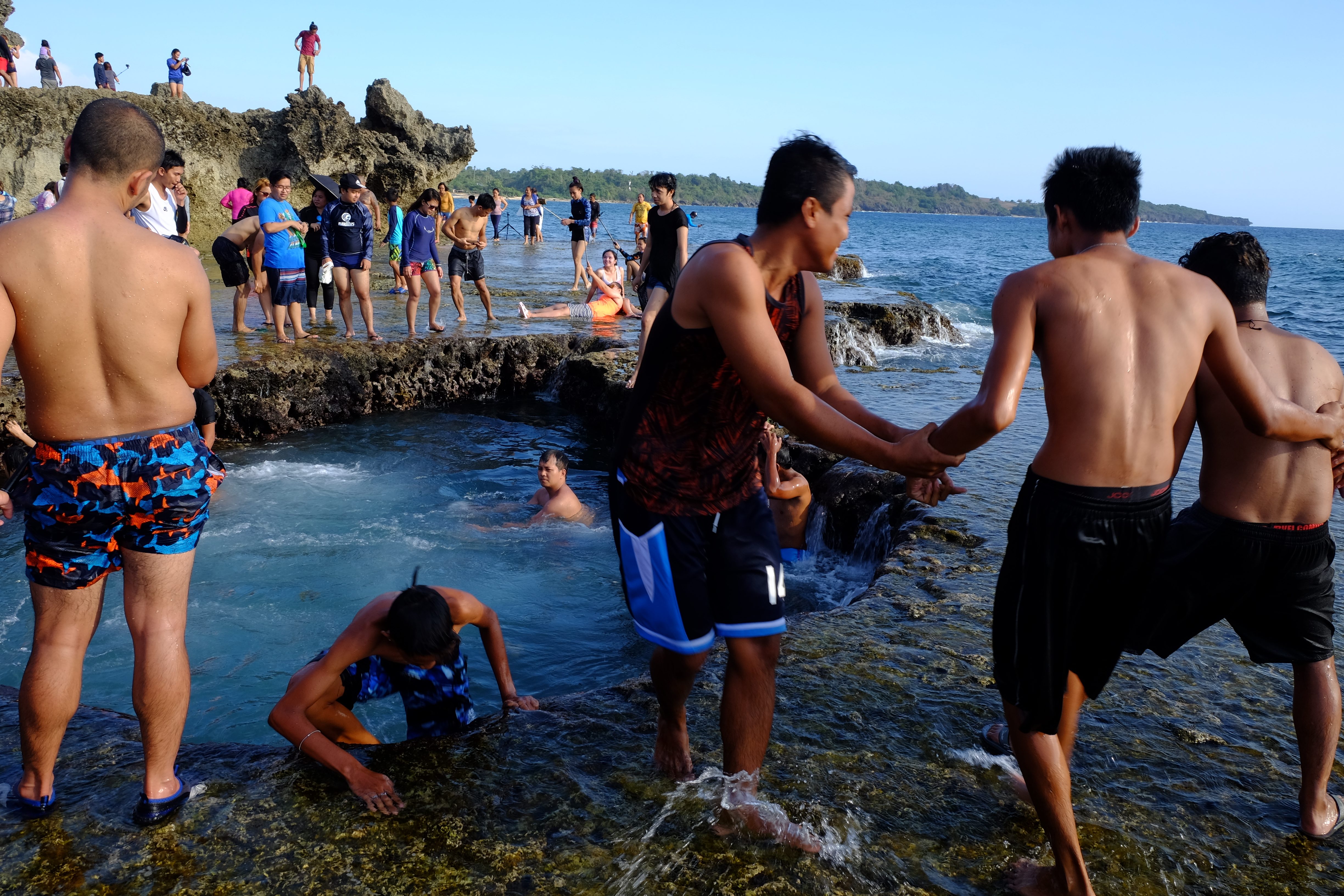 Beachgoers dare each other to try jumping into the challenge. Photo by Ramir G. Cambiado 