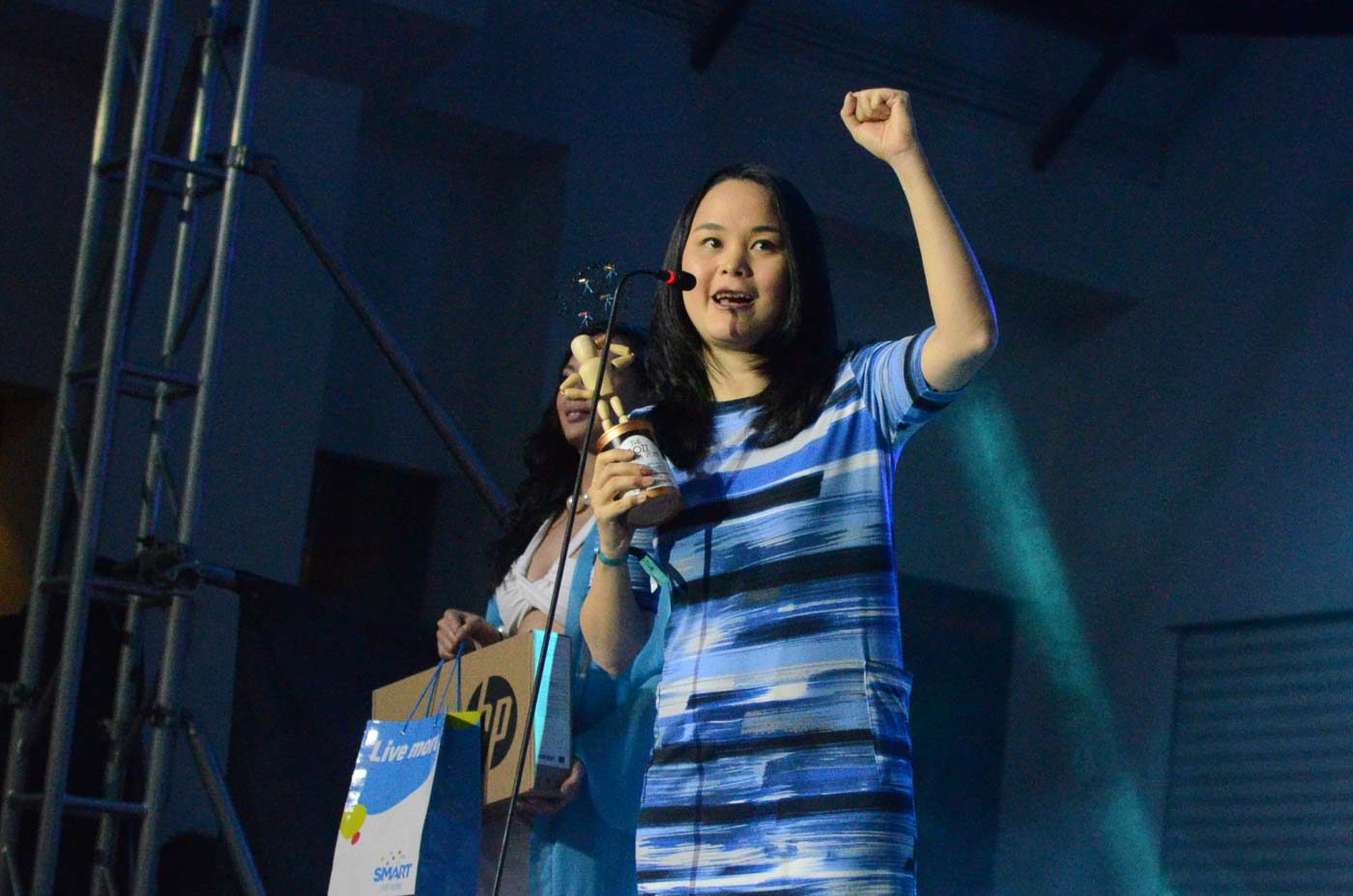 PUMPED. Boss for Social Responsibility Kristine Reyes-Lopez shares her victory with others. Photo by Alecs Ongcal/Rappler. 