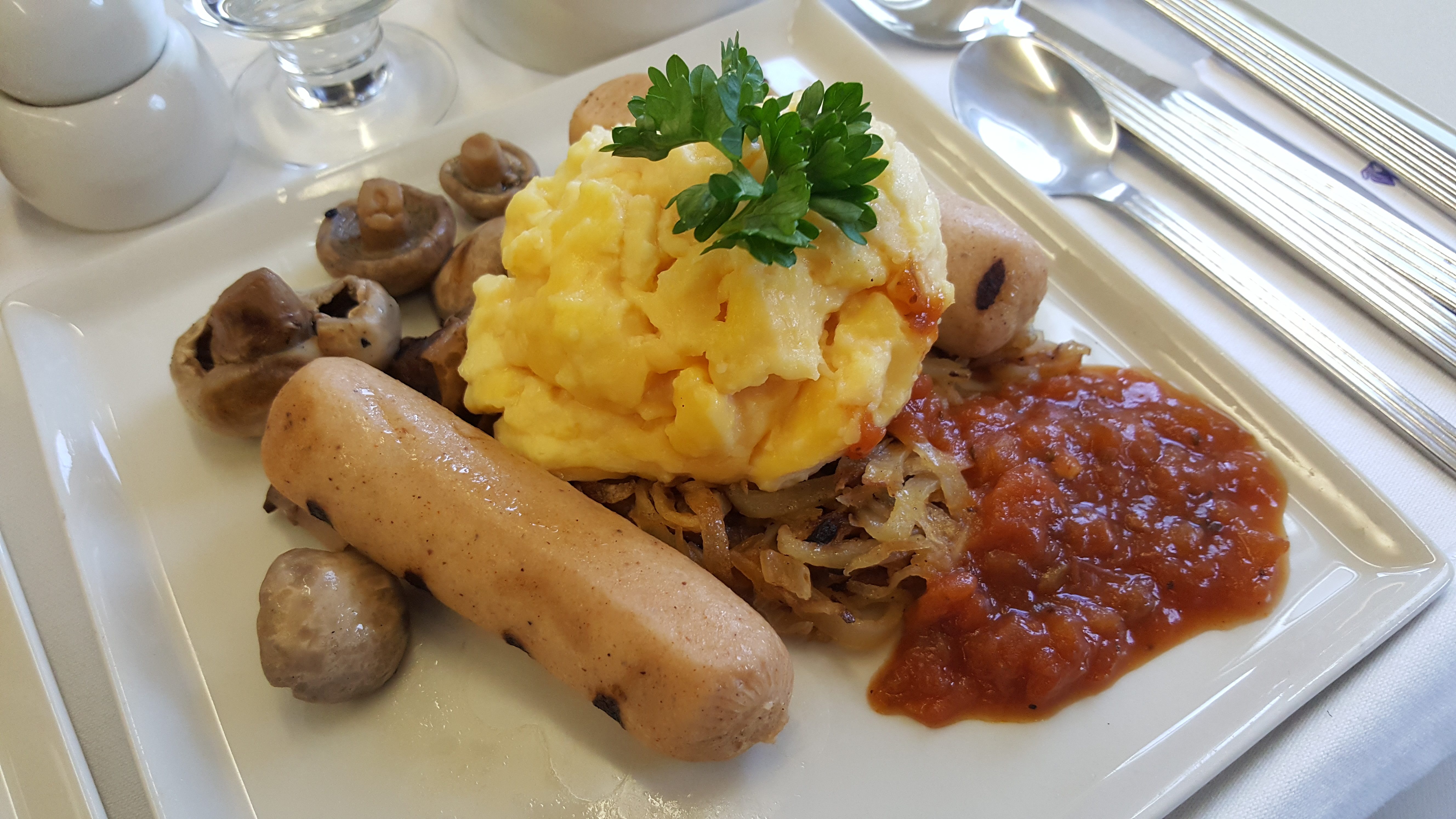 FIRST CLASS BREAKFAST. Sausage, eggs, and mushrooms  