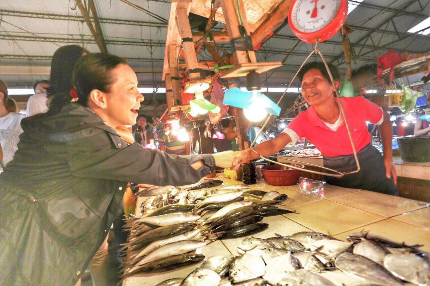 MARKET VISIT. Poe visits the Burgos public market on March 12, 2019. Photo from Team Grace Poe 