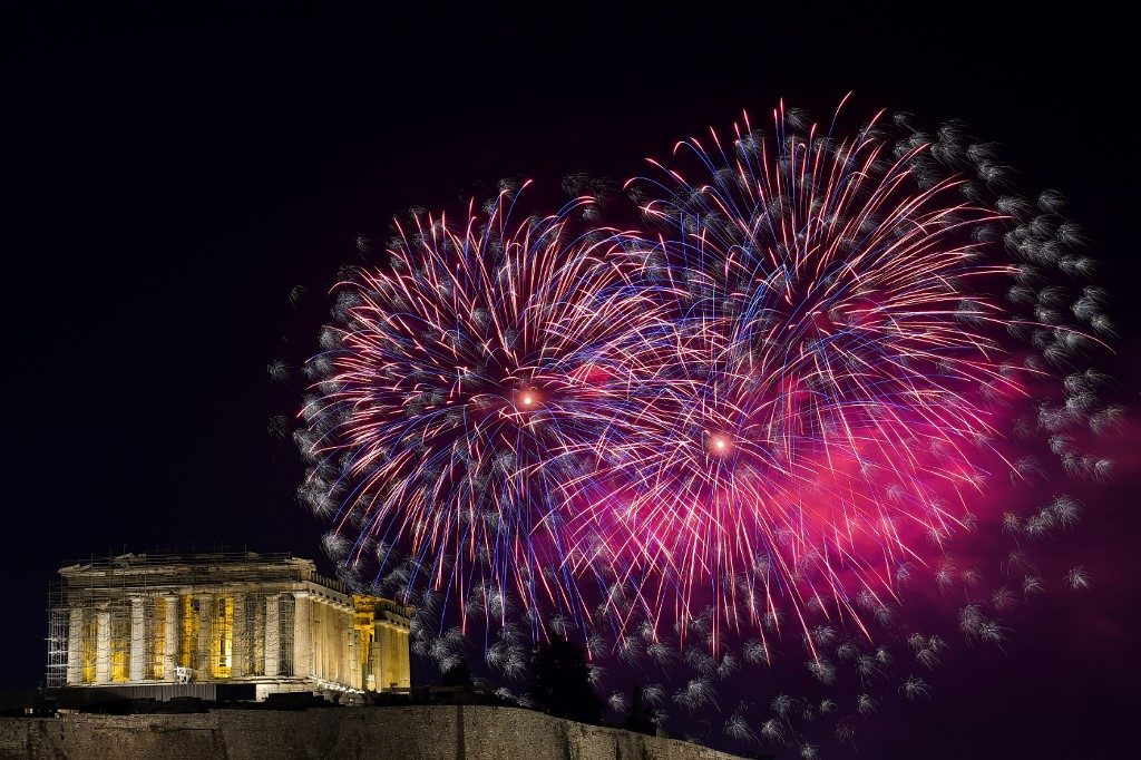 PARTHENON. Fireworks explode over the ancient temple of the Parthenon on top of the Acropolis hill as part of Greece's celebrations for the New Year in Athens on January 1, 2020. Photo by Aris Messinis/AFP 
