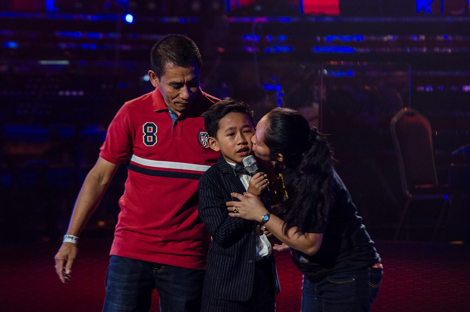 Joshua with his parents onstage Photo by Rob Reyes/Rappler 