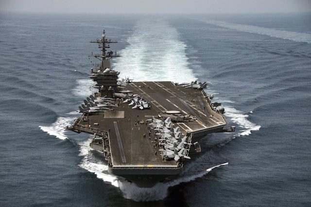 US defense chief visits aircraft carrier in South China Sea