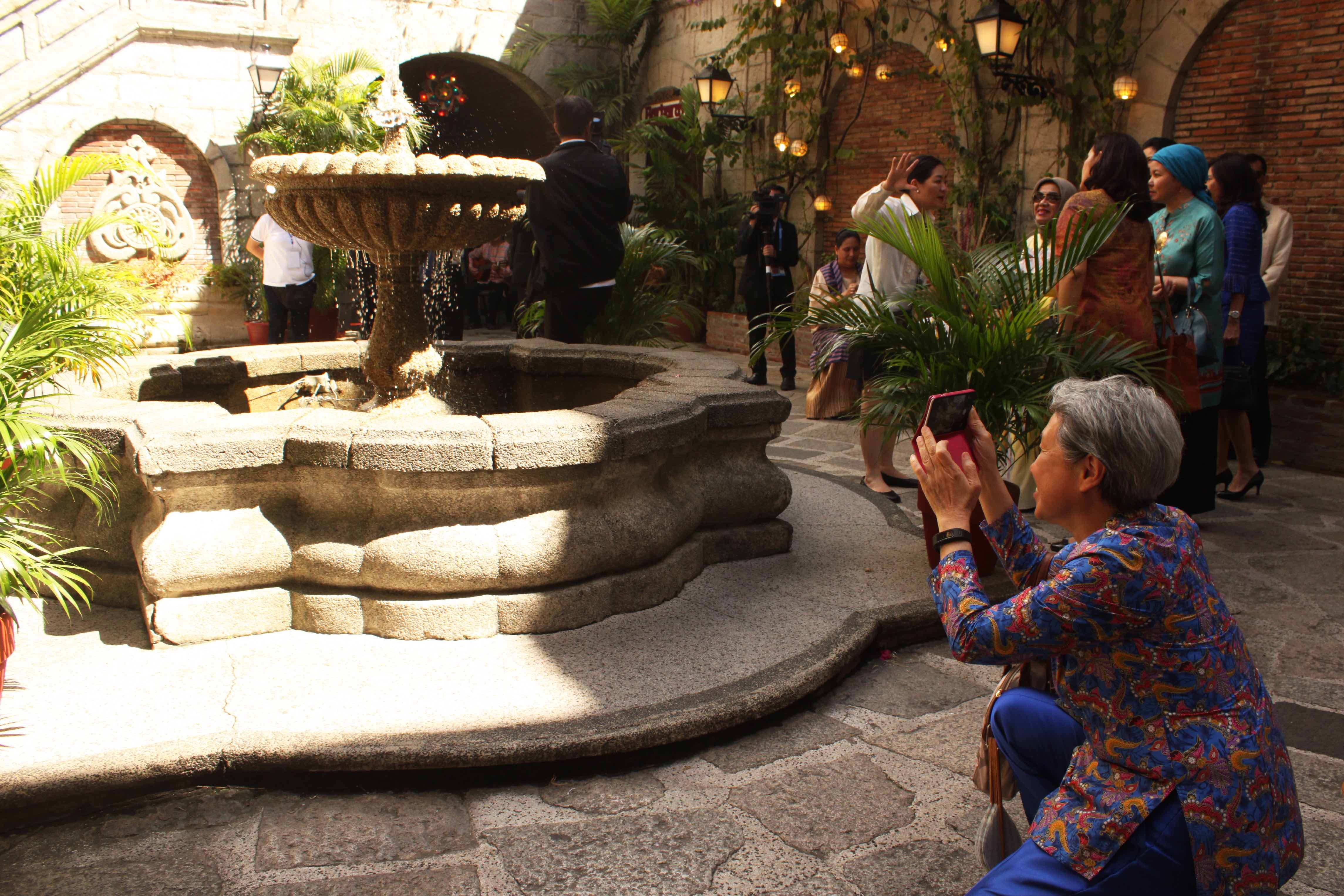 SIGHTSEEING. Ho Ching, wife of Singapore Prime Minister Lee Hsien Loong, takes a photo while touring around Intramuros.