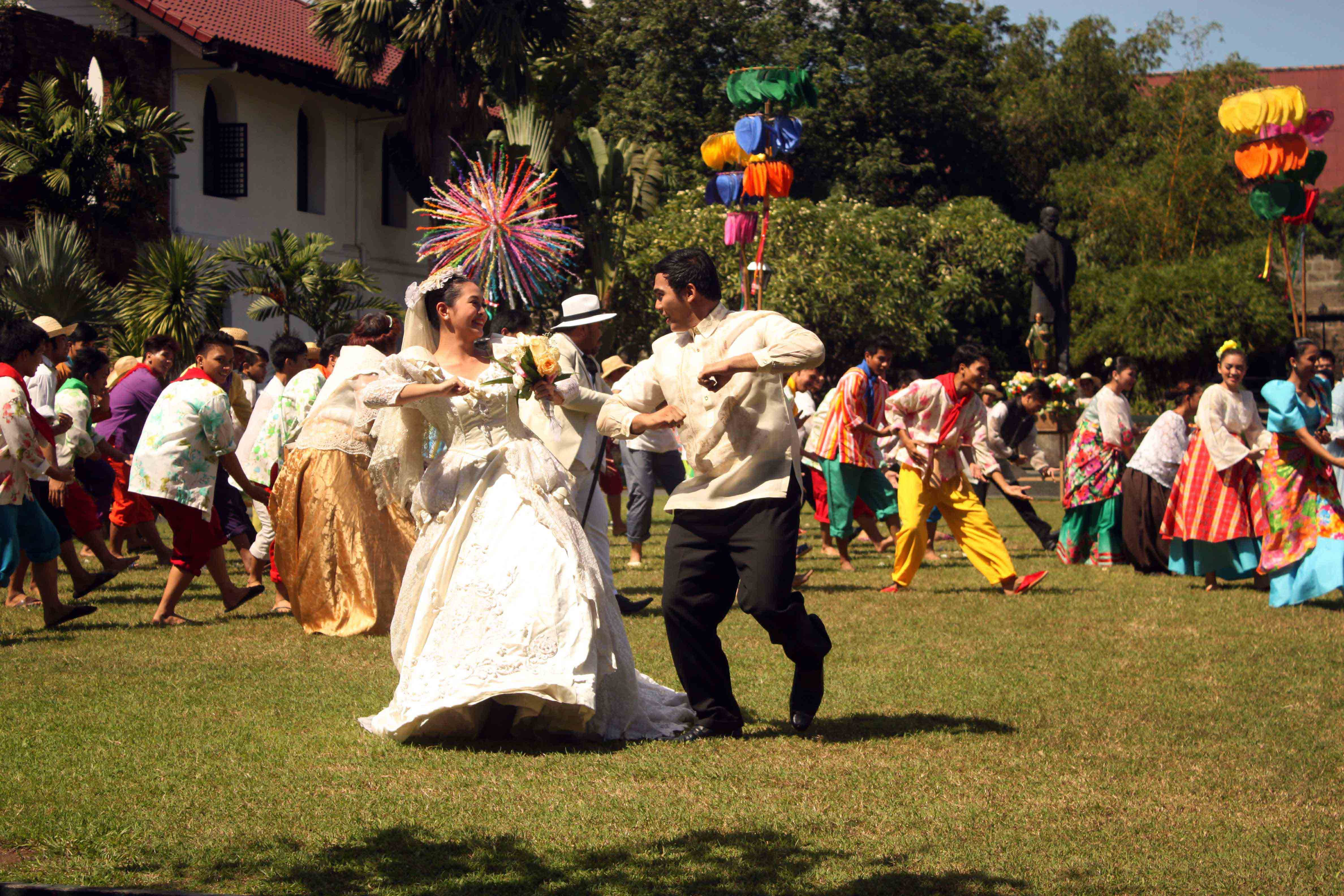 TRADITIONAL WEDDINGS. About 200 performers dance in front of the spouses in a showcase of the vibrant traditional weddings in the Philippines.