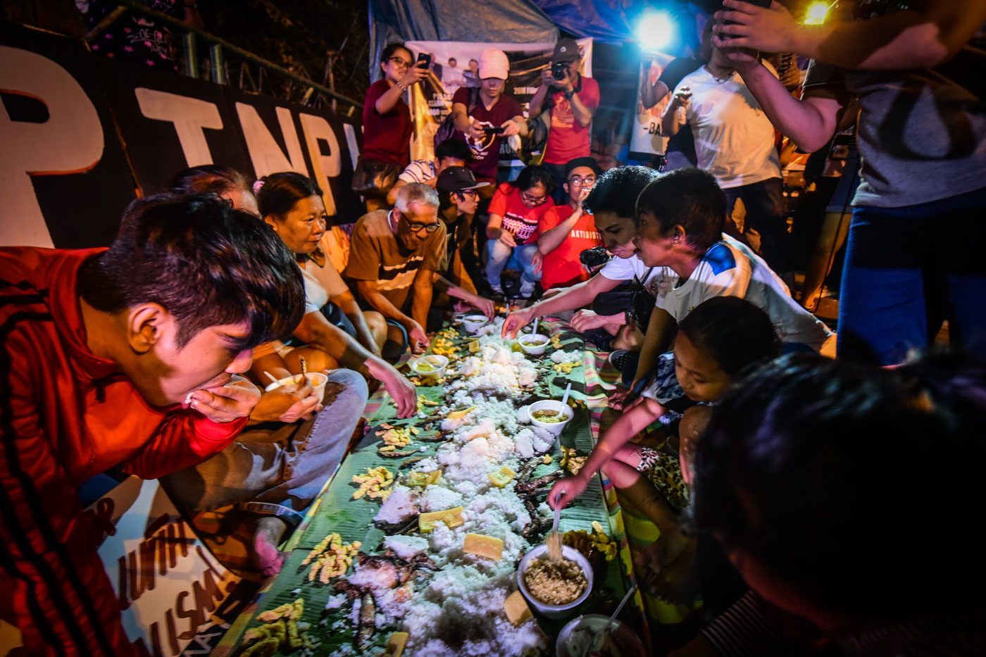 Homeless protesters have boodle fight while ASEAN leaders hold gala