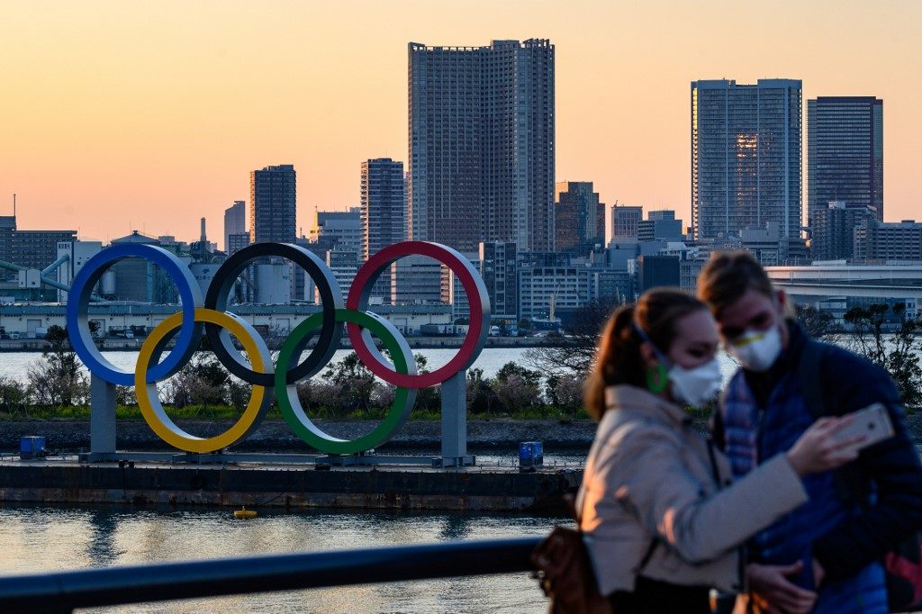 Olympic dreams on hold for Japan volunteers, hosts