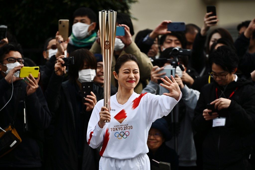 Japan bars children from Olympic torch ceremonies over virus fears