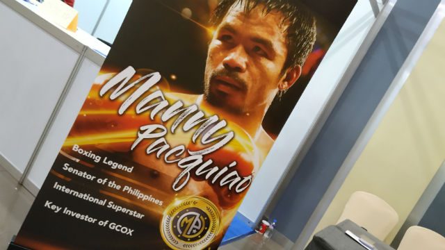 POSTER. Pacquiao's poster appears at the Blockchain Fair Asia 2018 in SMX Convention Center, SM Aura, Taguig City. Photo by Gelo Gonzales/Rappler   