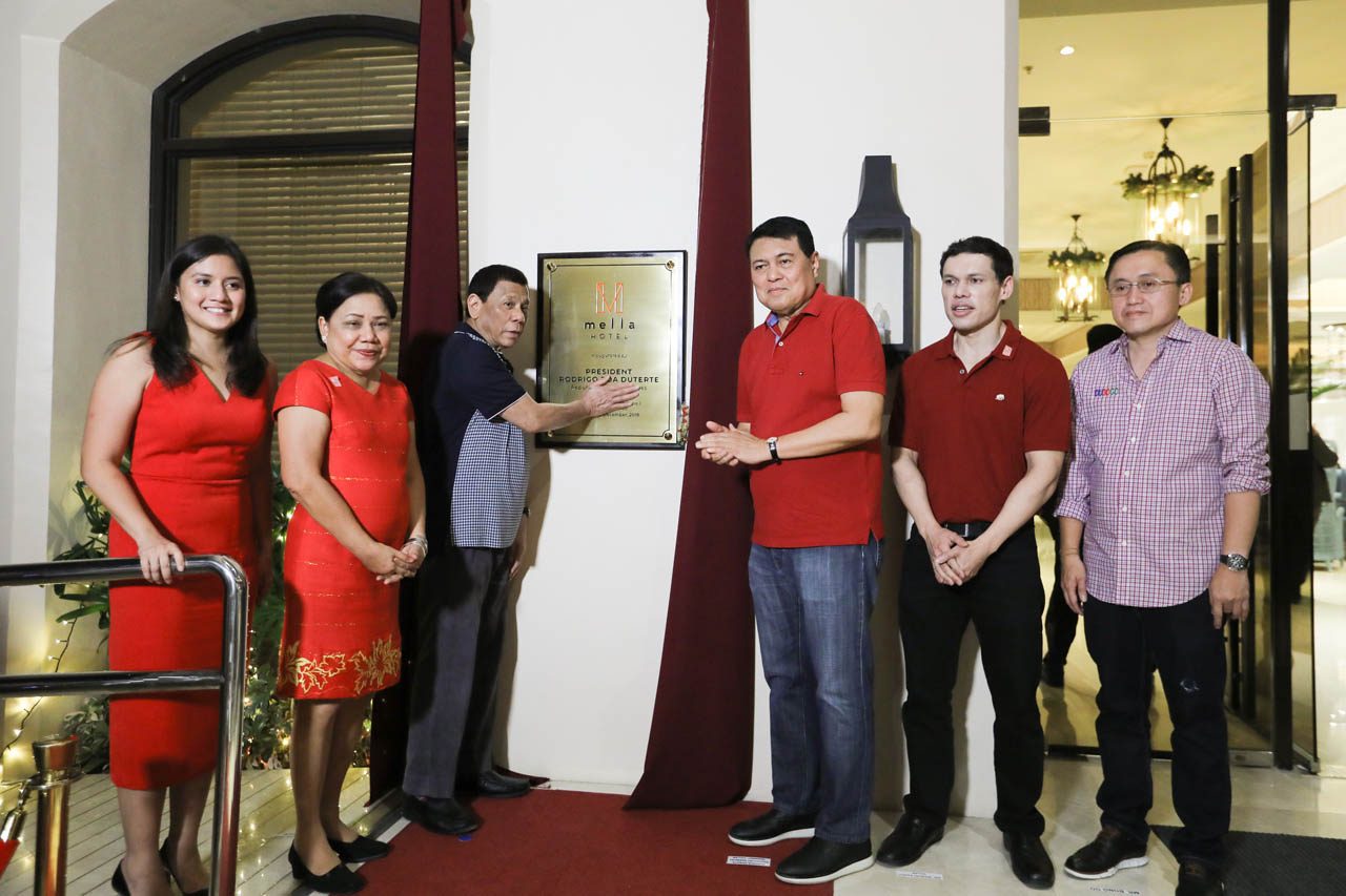 TIES. President Rodrigo Roa Duterte unveils the marker for the Mella Hotel Las Piñas in Barangay Pulang Lupa. Malacañang file photo   