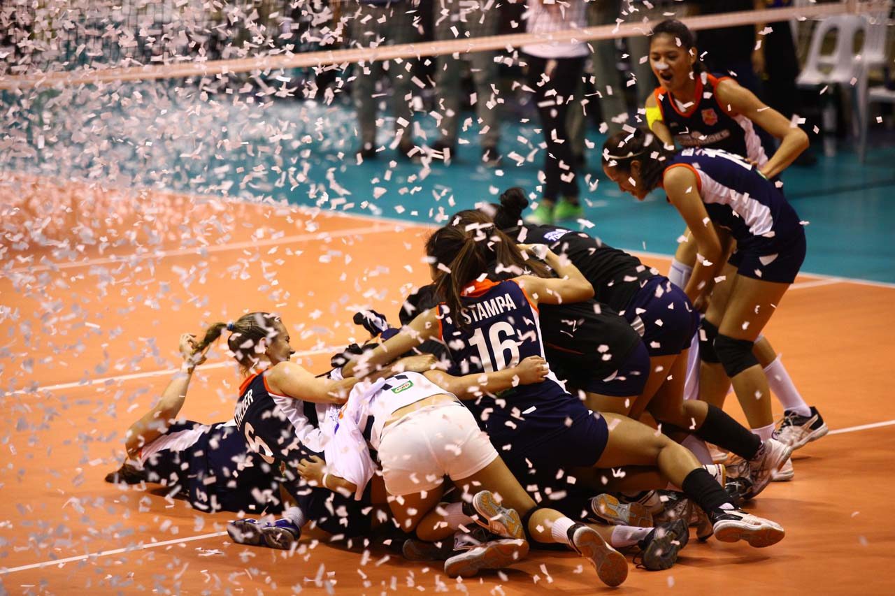CELEBRATION. The Tornadoes fall to the ground in triumph as they win the title. Photo by Josh Albelda/Rappler 