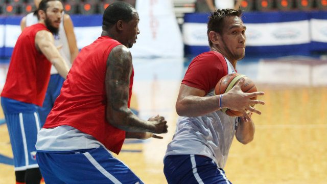 Gilas big men Marcus Douthit (L) and June Mar Fajardo (R) work in the post
