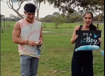 GENDER REVEAL. Max holds the gender announcement of their baby. Screenshot from YouTube/CasaMagno 