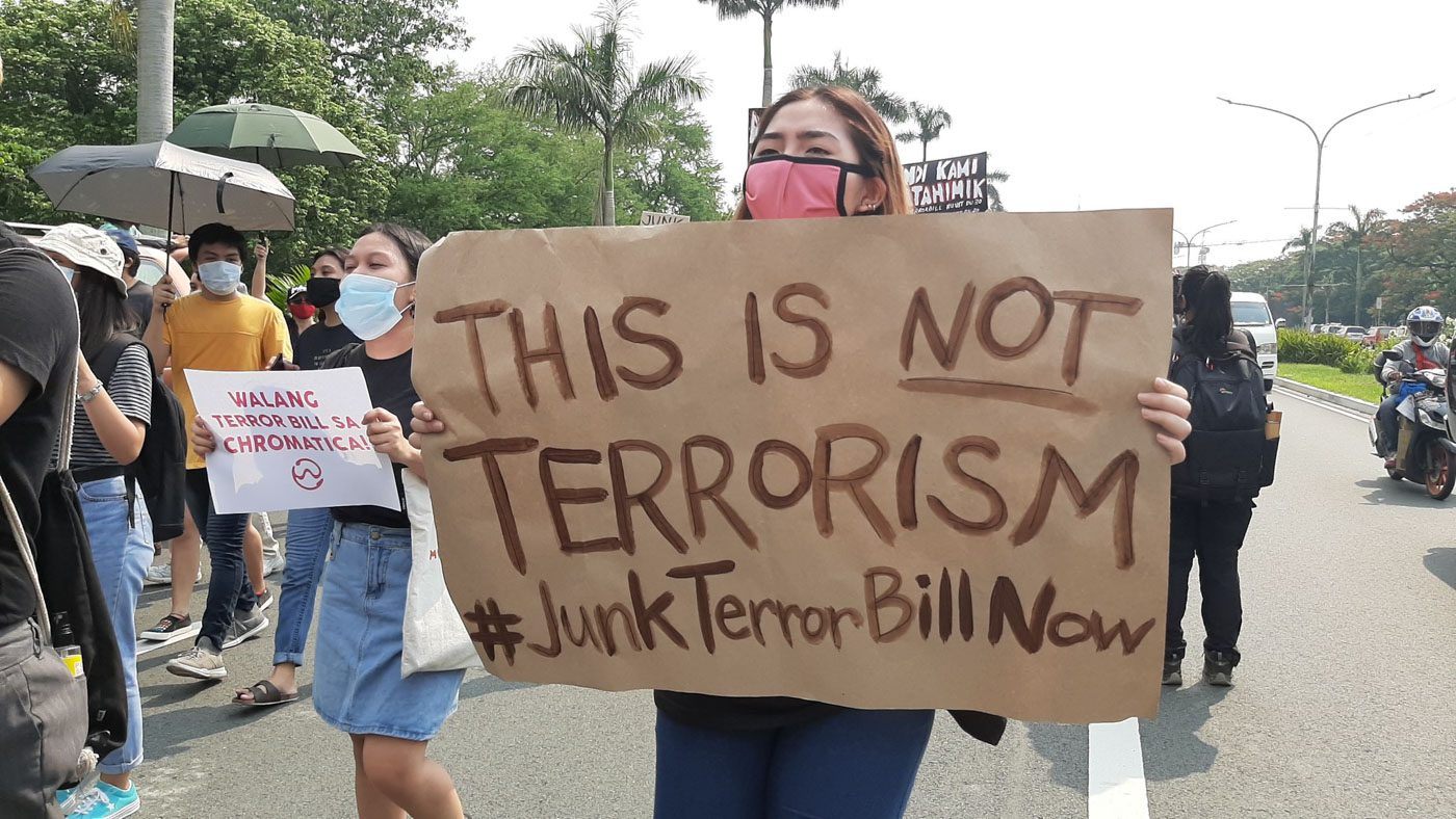 ACTIVISM IS NOT TERRORISM. Protester raises a creative placard on Thursday, June 4 to rally against the passing of the anti-terrorism bill. Photo from the College Editors' Guild of the Philippines 