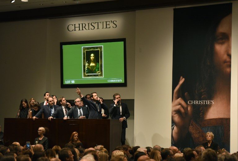 PRECIOUS. Christie's employees take bids for Leonardo da Vinci's 'Salvator Mundi' at Christie's New York on November 15, 2017. Photo by Timothy Claren/AFP  