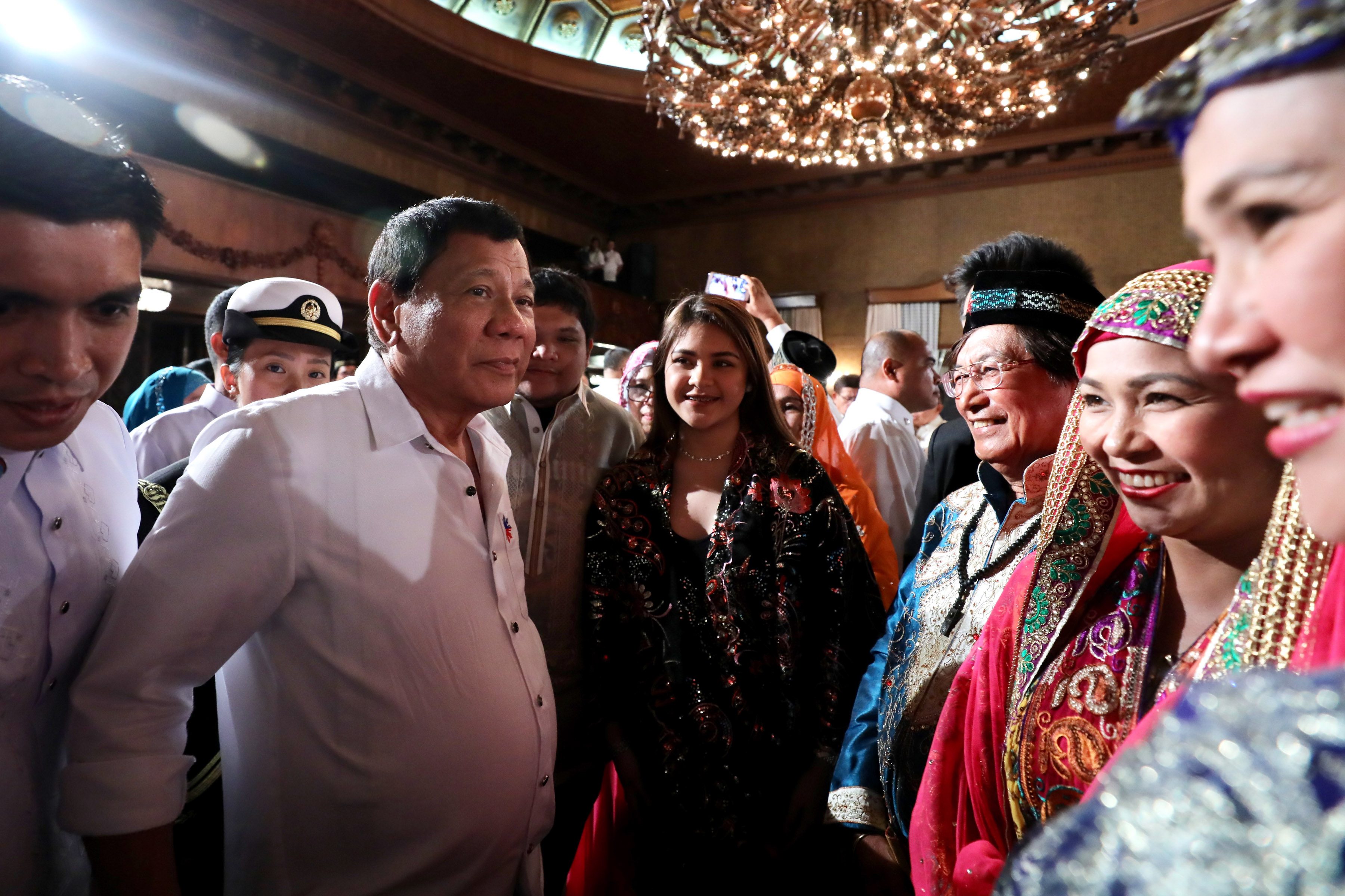 PALACE GUEST. President Duterte's grandchildren Isabelle (middle) and Omar attend the Eid'l Fitr celebration in Malacañang with their mother Lovelie Sangkola Sumera (foreground, in blue). Presidential photo  