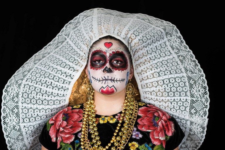 DAY OF THE DEAD. Student Veronica Magana Montanez poses for a photograph disguised as 'Catrina' (Mexican representation of death) during a Catrinas competition at the University of Michoacan in Morelia, Mexico on October 31, 2017. Photo by Omar Torres/AFP    