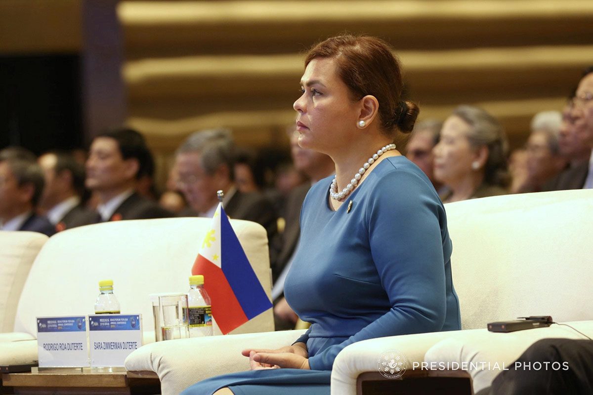 DAVAO MAYOR. Davao City Mayor Sara Duterte-Carpio listens as her father President Rodrigo Roa Duterte delivers his speech during the opening ceremony of Boao Forum for Asia (BFA) Annual Conference 2018 in China on April 10, 2018. Malacañang file photo 