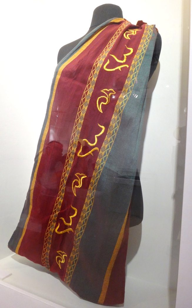 BAYBAYIN CLOTHING. The characters have also found their way in clothes. This is the sablay used for graduation ceremonies at the University of the Philippines. Photo taken at the National Museum 
