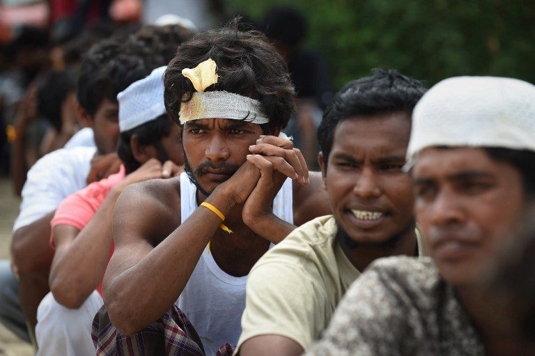WAITING. Rescued migrants from Bangladesh wait for an identification process by Indonesian authorities and the International Organization for Migration at the confinement area in the fishing port of Kuala Langsa in Aceh province on May 17, 2015. Romeo Gacad/AFP 