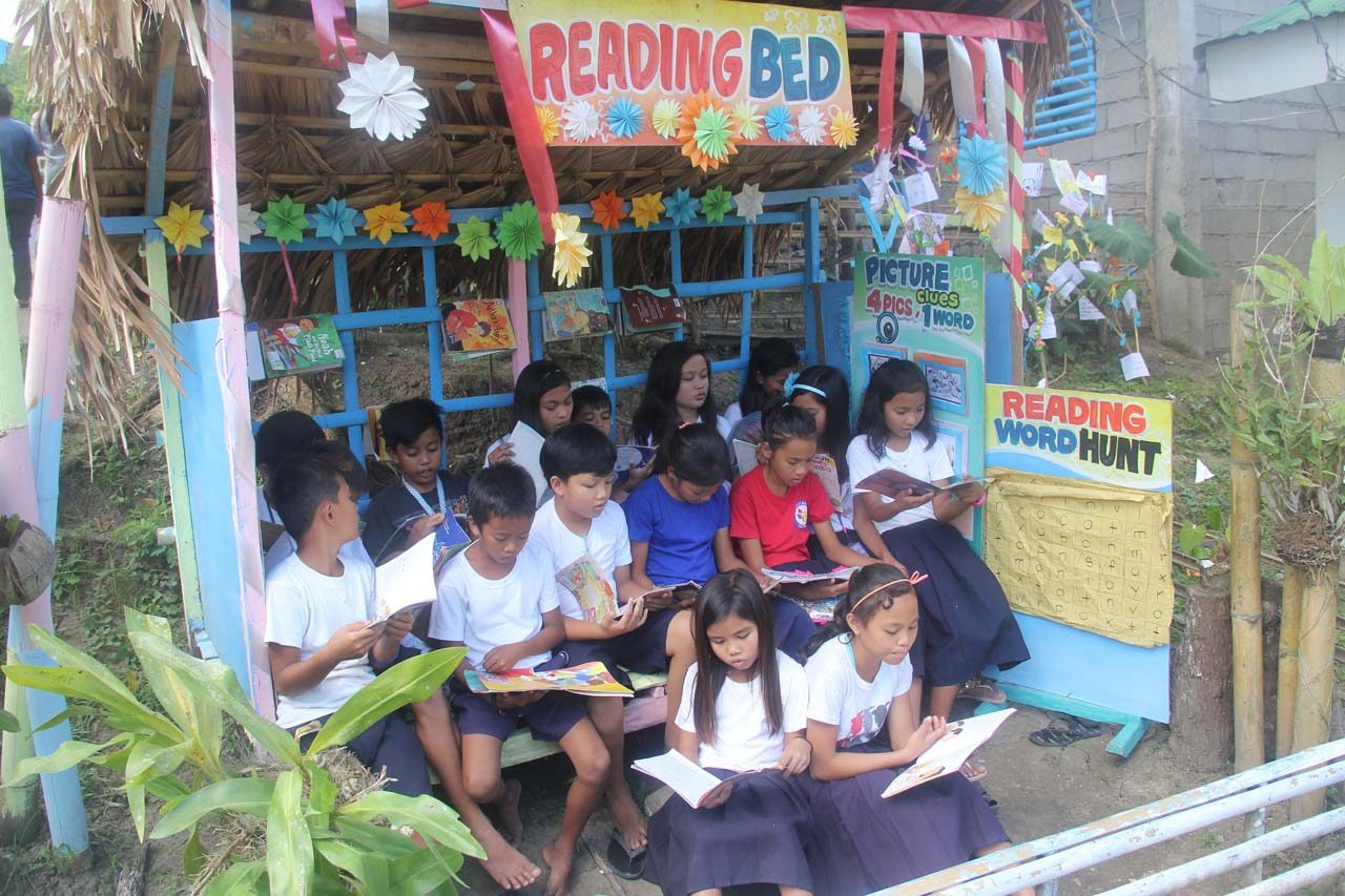 READING BED. Students of San Jose Elementary School in Donsol, Sorsogon read books. 
