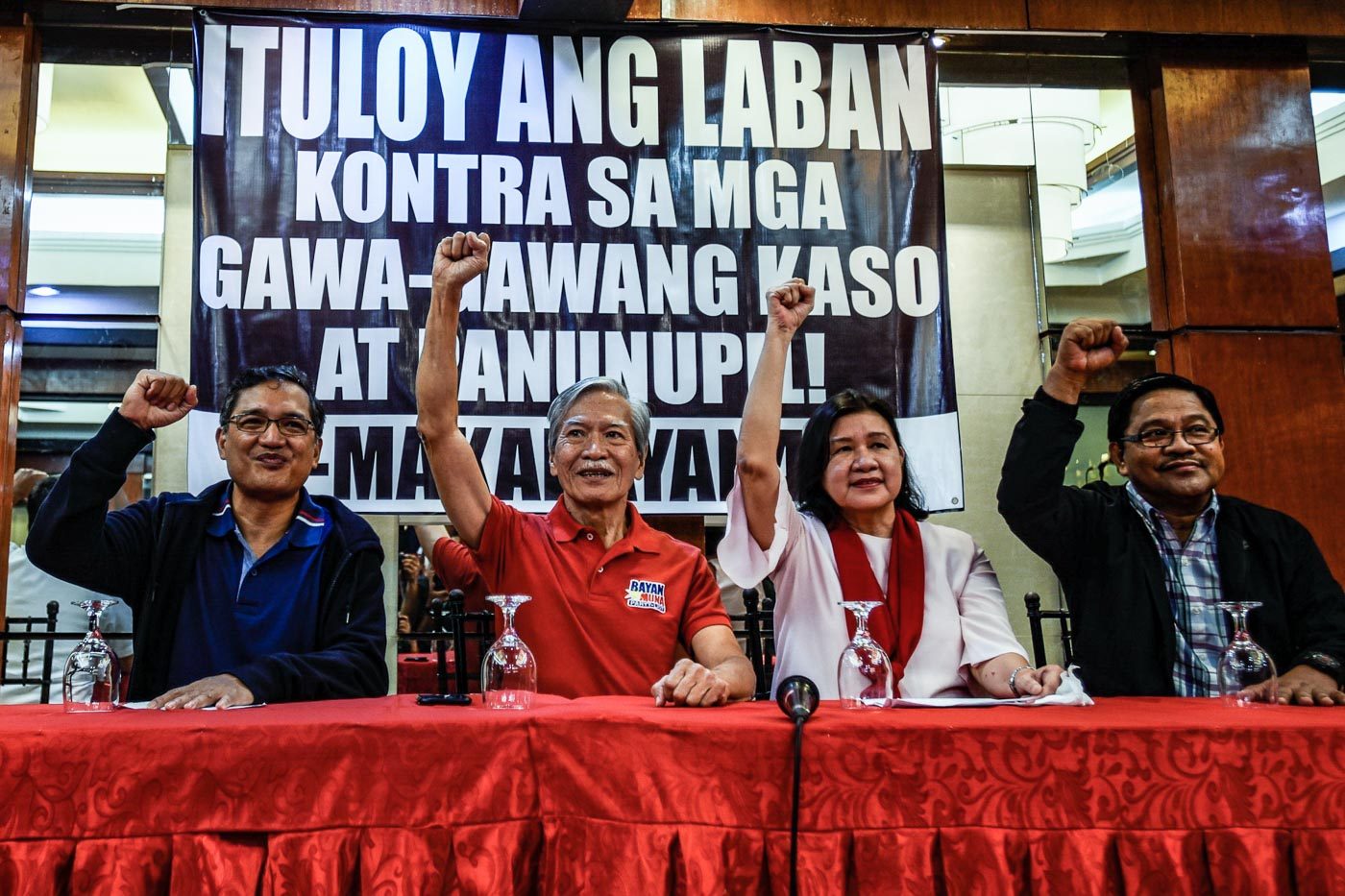 OUT. Former Lawmakers (from left) Teodoro Casino, Satur Ocampo, incumbent Anti-Poverty Secretary Liza Maza and Former Agrarian Reform secretary Rafael Mariano, raise their clenched fist during a press conference in Quezon City on August 14, 2018 after a Nueva Ecija court clears them from murder charges. Photo by Maria Tan/Rappler  