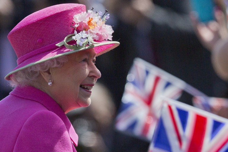Britain's Queen Elizabeth II smiles as she arrives to open a bandstand at Alexandra Gardens in Windsor, west of London, on April 20, 2016, the day before her 90th birthday. Justin Tallis/AFP 