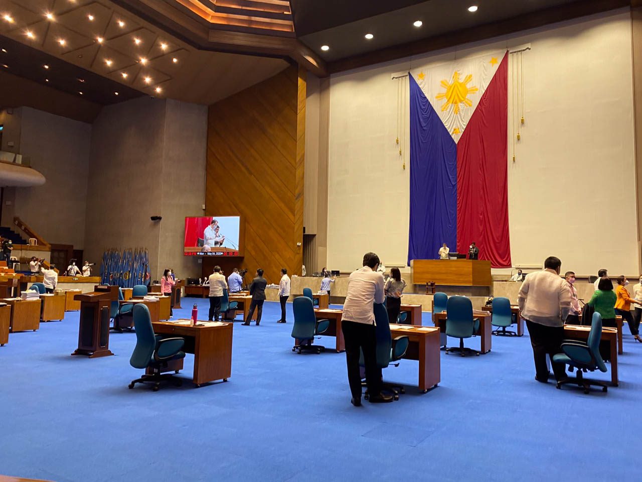 PHYSICAL DISTANCE. Congressmen's tables are spaced more than a meter apart as Congress resumes session. Photo from the Office of House Majority Leader Martin Romualdez  