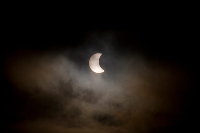 Thousands scan skies for glimpse of ‘amazing’ solar eclipse