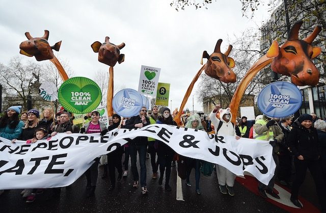 Climate change protesters march through London during a demonstration in London, Britain, November 29, 2015. Andy Rain/EPA 