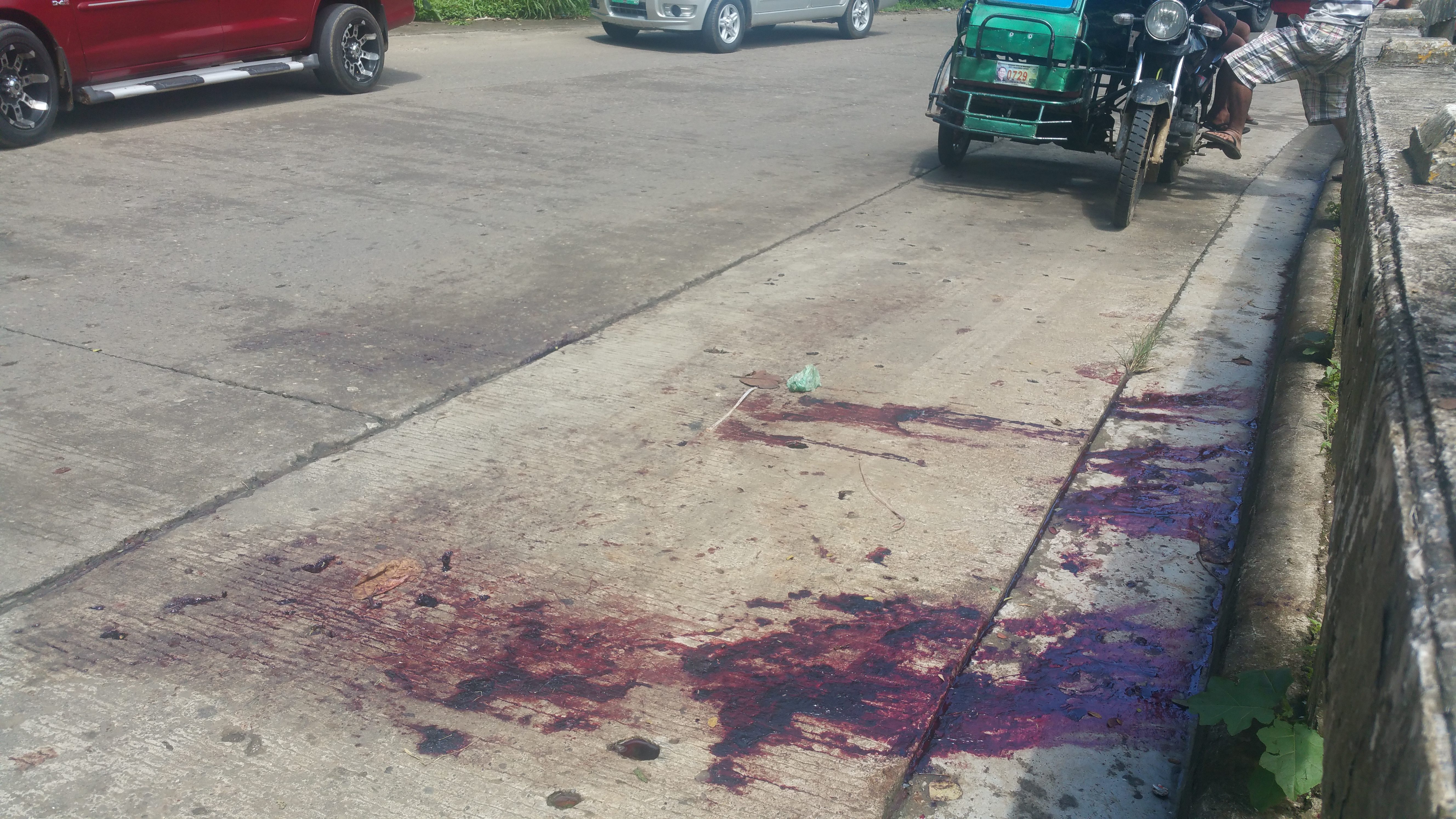 BLOOD SPILLED. Blood stains on the pavement near the site of the killing. Photo by Bobby Lagsa/Rappler 