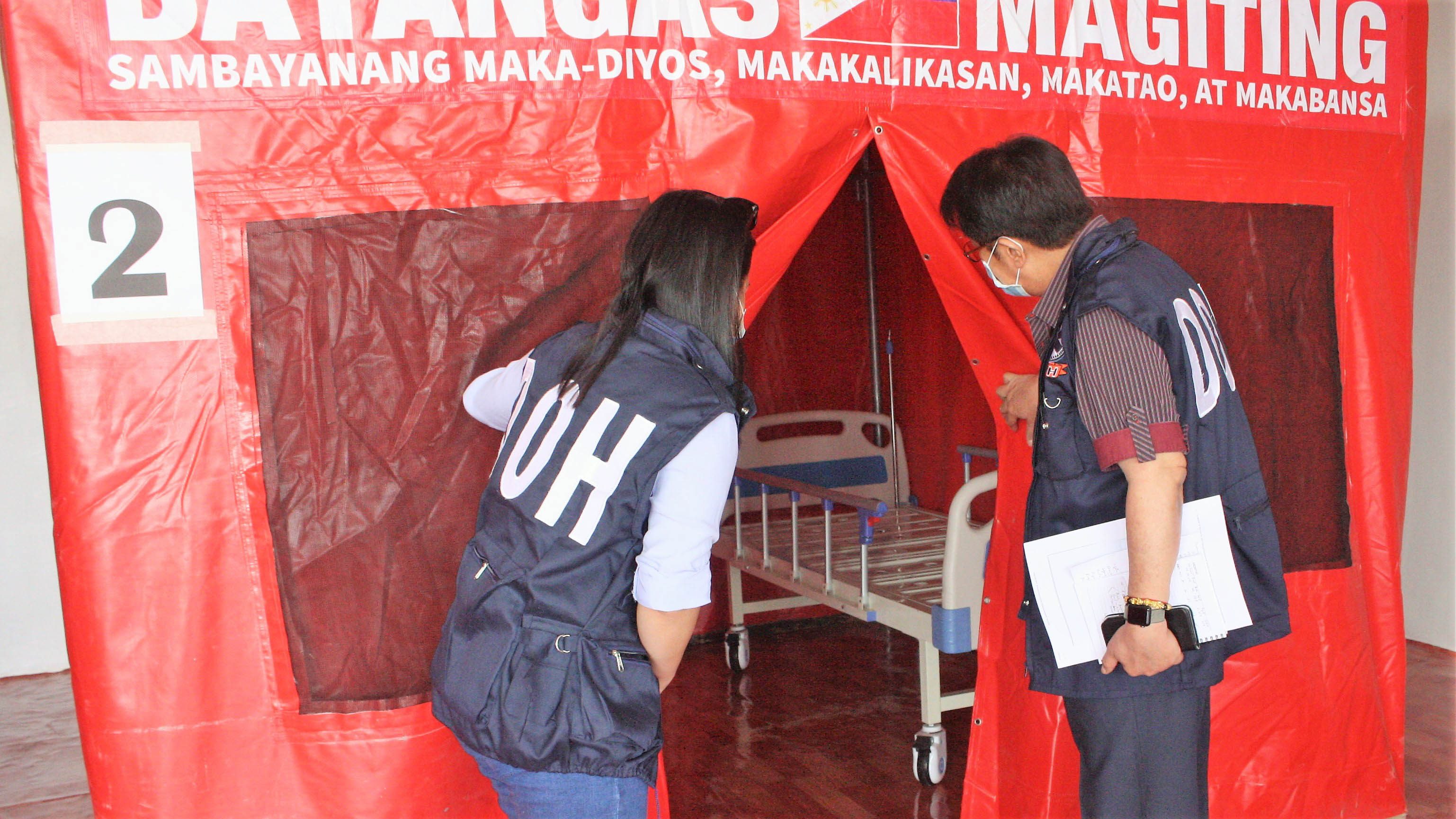 ISOLATION FACILITY. DOH-CALABARZON Regional Director Eduardo C. Janairo (left) inspects the inside of tent which will serve as an isolation unit for persons deprived of liberty who will be tested positive for COVID-19. The Batangas Provincial Isolation Facility is located at Brgy Malainin, Ibaan. Photo from DOH Calabarzon   