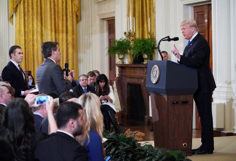 PRESIDENT VS THE PRESS. US President Donald Trump gets into a heated exchange with CNN chief White House correspondent Jim Acosta (canter) during a post-election press conference at the White House on November 7, 2018. Photo by Mandel Ngan/AFP  
