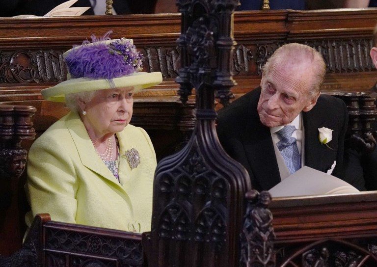THE QUEEN. Britain's Queen Elizabeth II and Britain's Prince Philip, Duke of Edinburgh (R), during the wedding ceremony of Britain's Prince Harry, Duke of Sussex and US actress Meghan Markle in St George's Chapel, Windsor Castle, in Windsor, on May 19, 2018. Photo by Jonathan Brady/Pool/AFP 