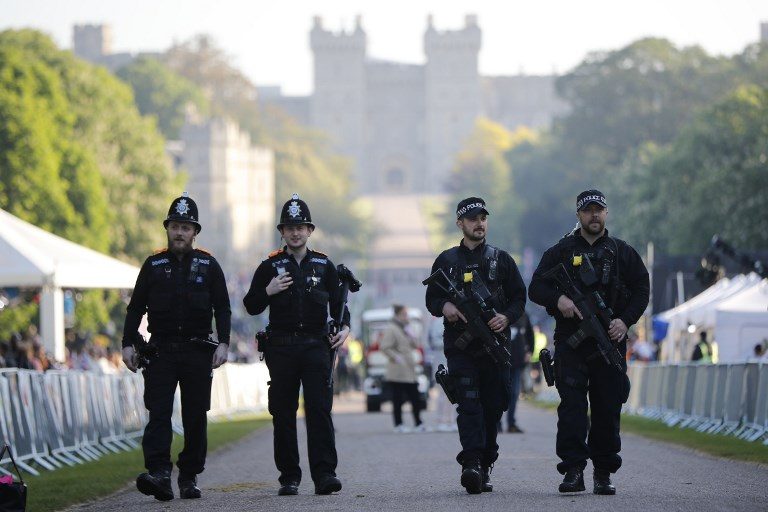 PATROL/ Armed police patrol on the Long Walk leading to Windsor Castle ahead of the wedding and carriage procession of Britain's Prince Harry and Meghan Markle in Windsor, on May 19, 2018. Photo by Tolga Akmen/AFP 