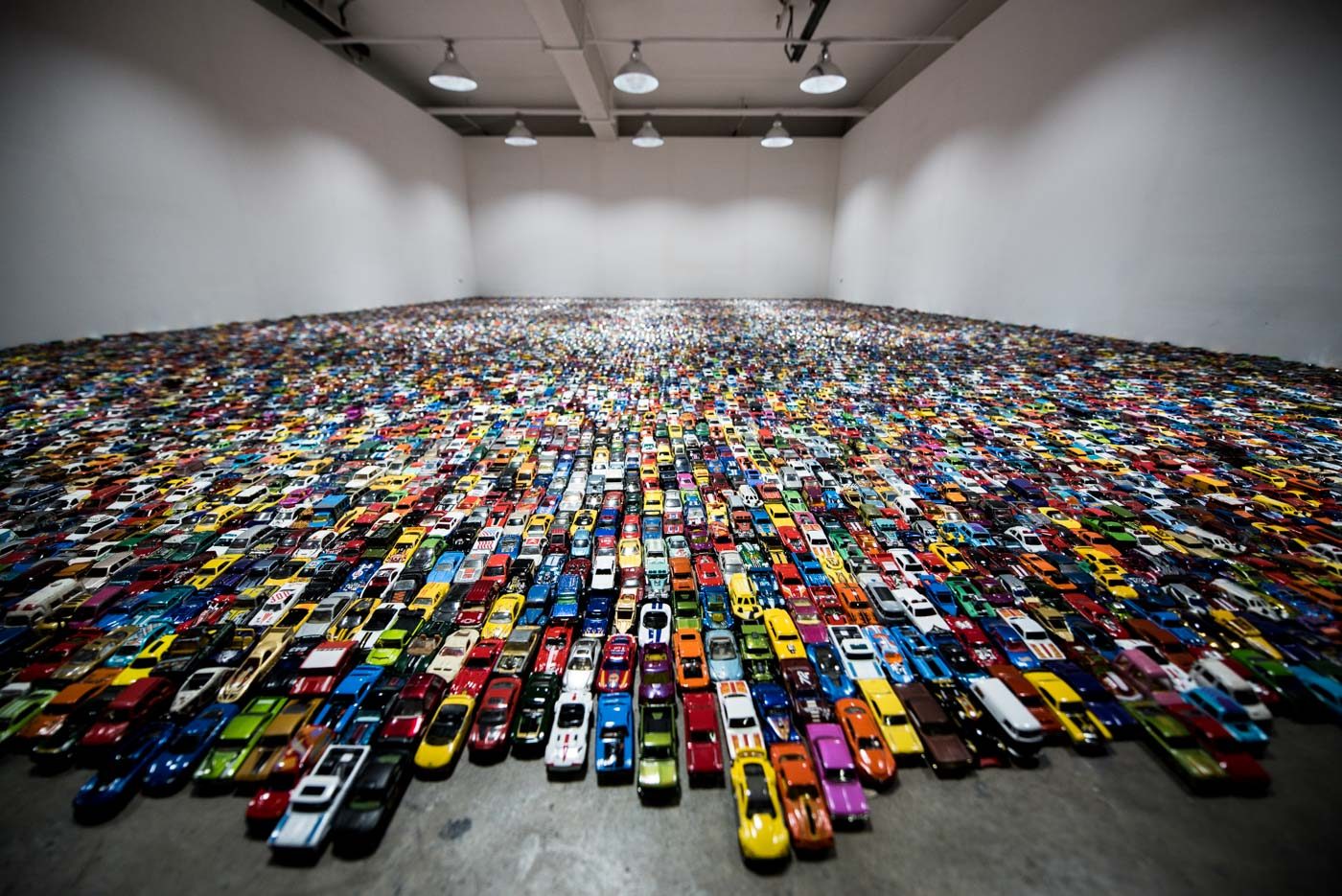 SEA OF CARS. The installation by Nilo Ilarde features 24,124 cars. 